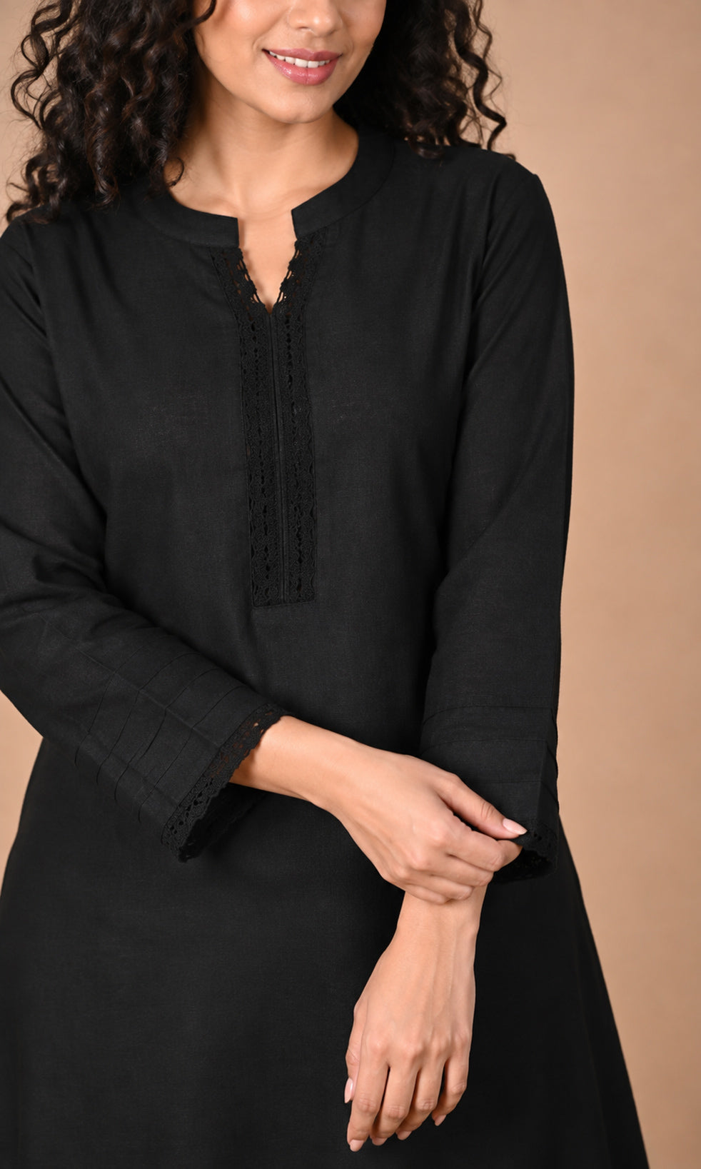 Black cotton kurta hem and lace edging detail